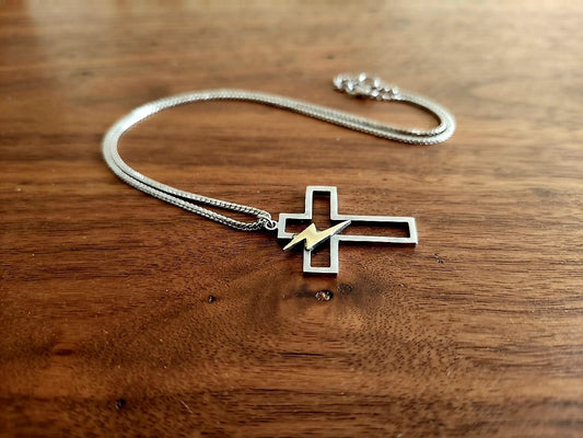 Cross necklace with bolt details