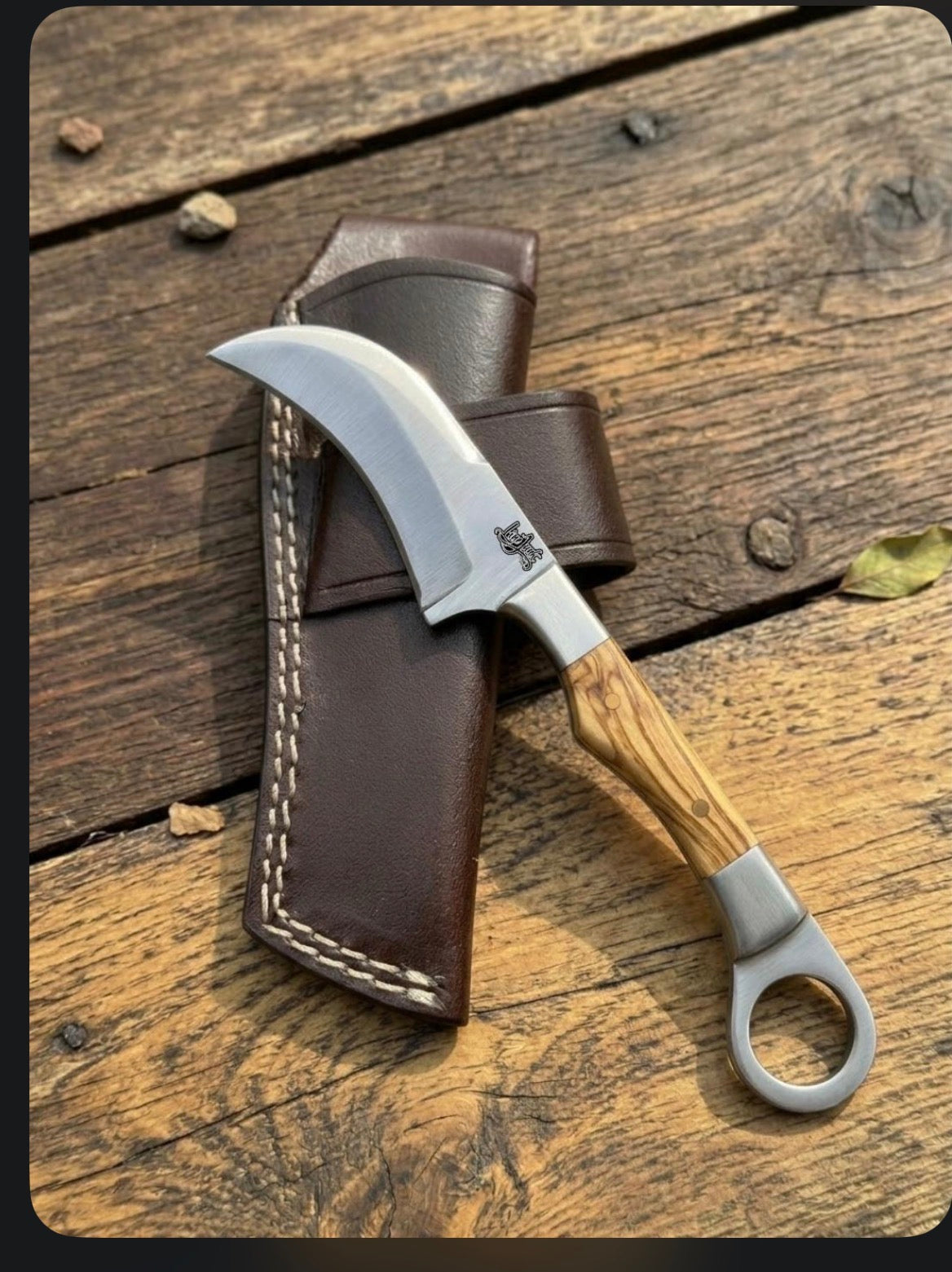 Hawkbill knife with leather sheath