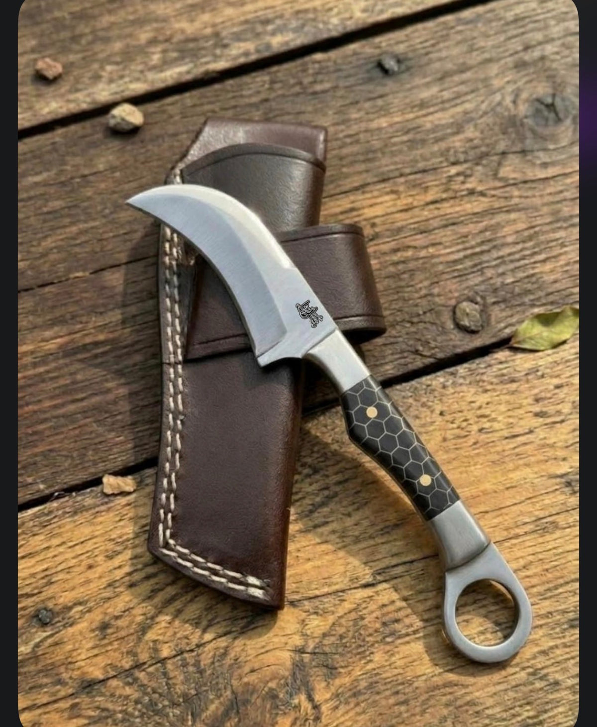 Hawkbill knife with leather sheath
