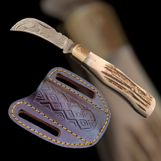 Hawkbill folding knife with stag horn handle